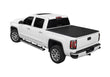 Load image into Gallery viewer, Lomax Hard Folding cover on a white GMC Sierra truck.