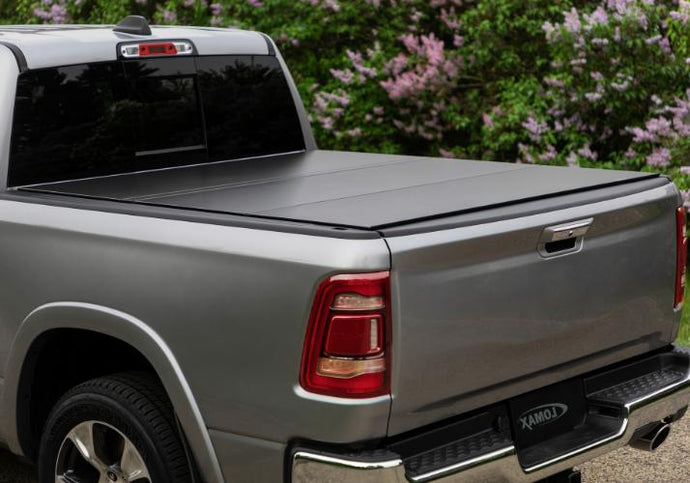 Lomax Hard Folding Cover closed on a silver Ram 1500.
