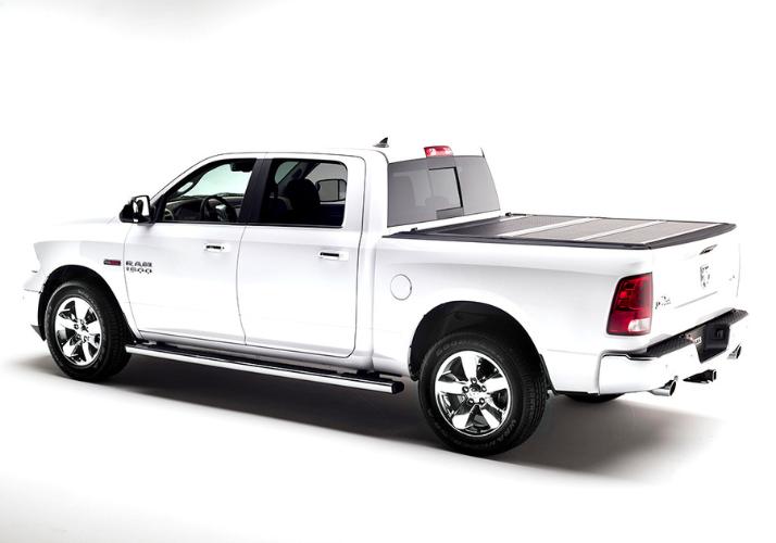 Low profile design of the BAKFlip F1 being displayed on a white Ram 1500 truck.