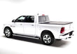 Load image into Gallery viewer, Low profile design of the BAKFlip F1 being displayed on a white Ram 1500 truck.