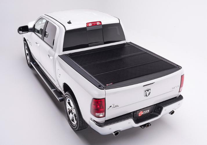 BAKFlip F1 displayed closed on a white Ram 1500 truck.