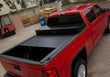 Load image into Gallery viewer, Truck Covers USA Work Cover displayed half way open on a red Chevy Silverado 1500.