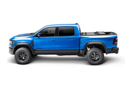 BAKFlip MX4 is being displayed on a blue Ram 1500 truck.