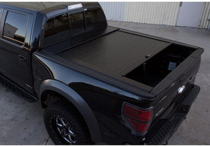 Truck Covers USA American Roll Cover displayed partially open on a black Ford F150. 