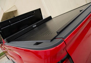 Truck Covers USA Work Cover displayed with toolbox open on a red Chevy Silverado 1500.