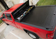 Load image into Gallery viewer, Truck Covers USA Work Cover displayed on a red Chevy Silverado 1500 with toolbox open and cover closed. 
