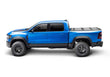 Load image into Gallery viewer, BAKFlip MX4 is being displayed closed on a blue Ram 1500 truck