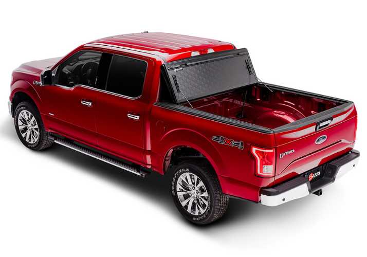 BAKFlip G2 is being displayed folded all the way open on a red Ford F150 truck.