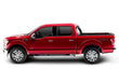 Load image into Gallery viewer, Profile view of the BAKFlip G2 being displayed folded all the way open on a red Ford F150 truck.